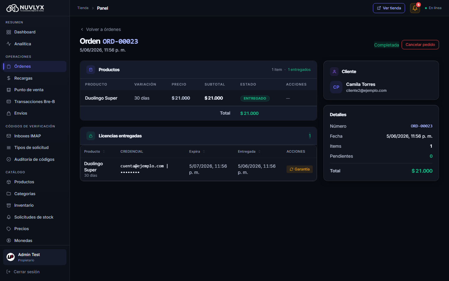 Detalle de una orden completada con productos, licencia entregada y botón Garantía